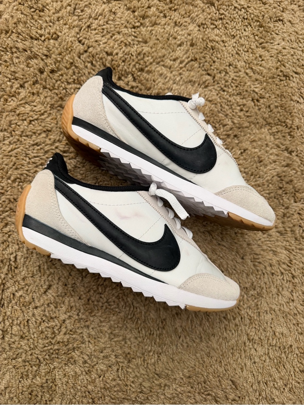 Nike White Sneakers with Black Swoosh and Gum Sole